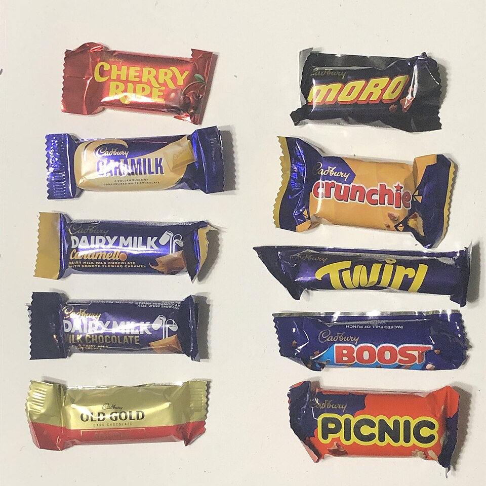 Ten Pieces of Cadbury Chocolate Bars Group Up Together.jpg — Brassluff (CC0) Cadbury Purple