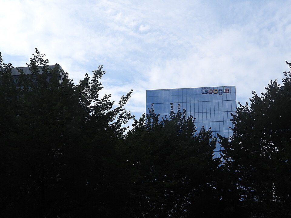 Google office building in Toronto framed by trees.jpg — Wiki.cullin (CC0) Google Red