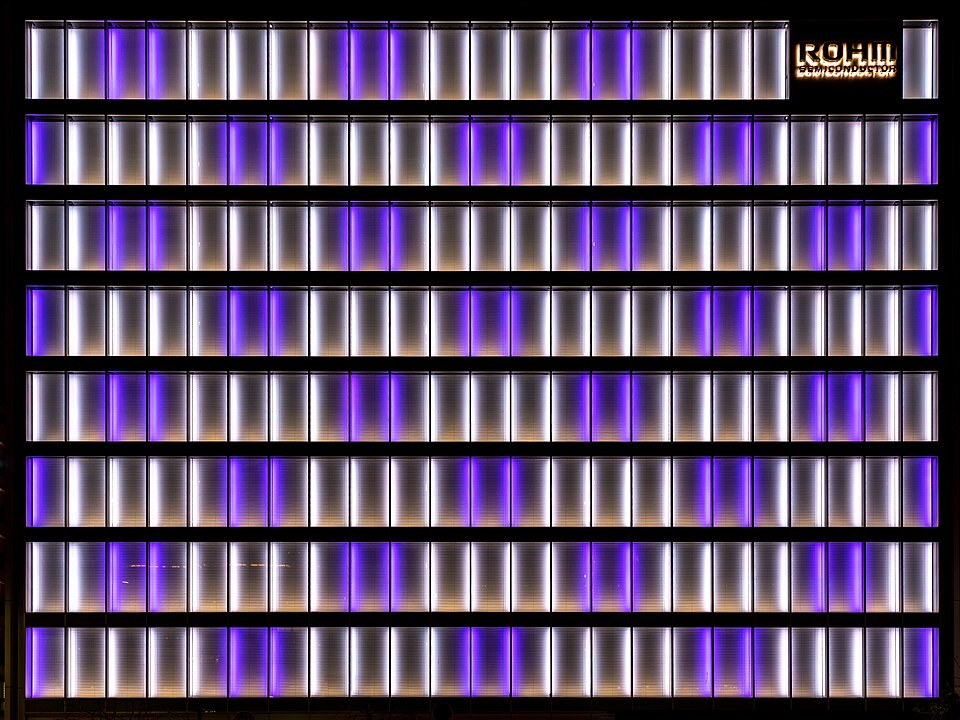 Illuminated white and purple facade of the office building Rohm Semiconductor in Kyoto, Japan.jpg — Basile Morin (CC BY-SA 4.0) LinkedIn Blue