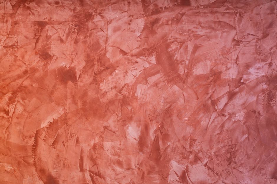 赤缇 — Reddish textured plaster wall perfect for backgrounds and design projects.