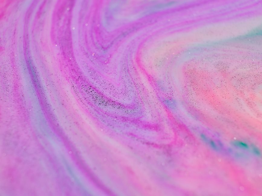 木槿 — A close-up of a vibrant pink and purple abstract swirl creating a dynamic artistic texture.