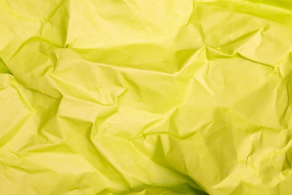 田赤 — High-quality close-up of crumpled yellow paper texture, perfect for background designs.