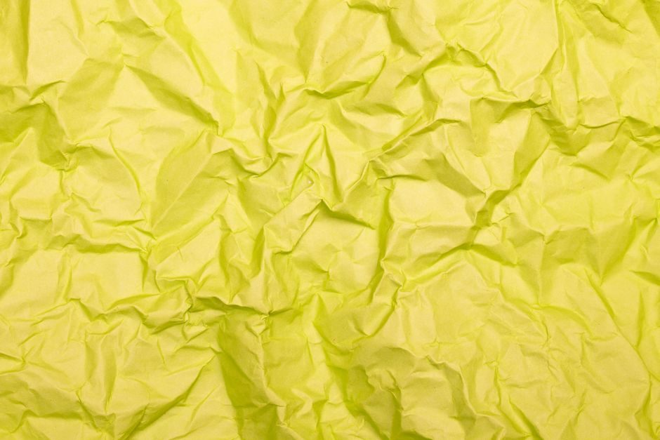 缃叶 — High-resolution texture of crumpled yellow paper ideal for backgrounds and design projects.